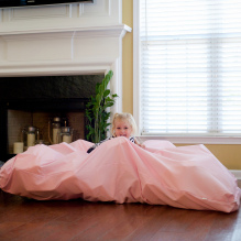 sensory room girl with pink blanket