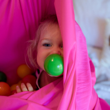 Sensory room baby with ball in mouth