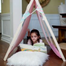 Sensory spaces girl reading book in tent